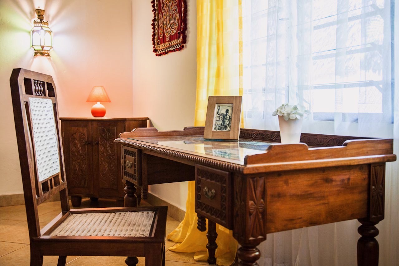 Hand-carved wooden desk and chair in the villa