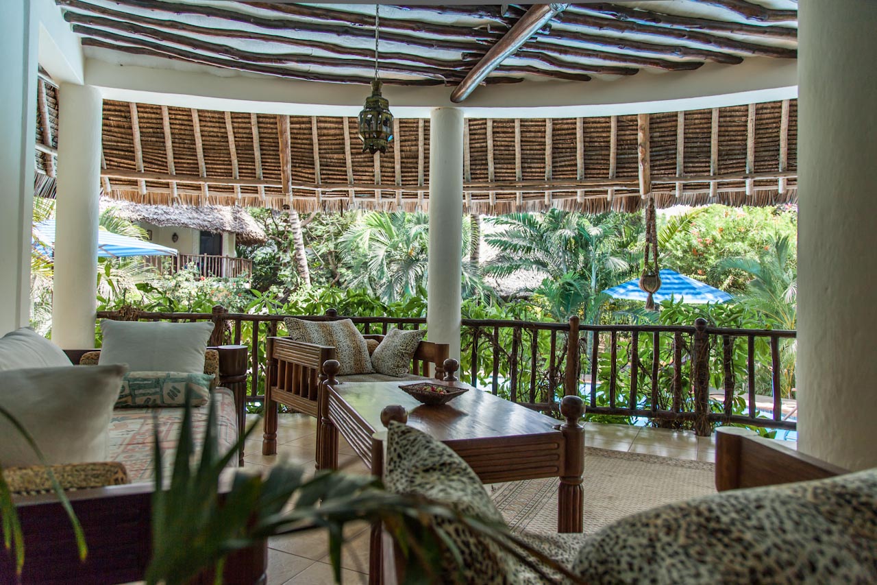 Upstairs veranda lounge overlooking the pool and garden