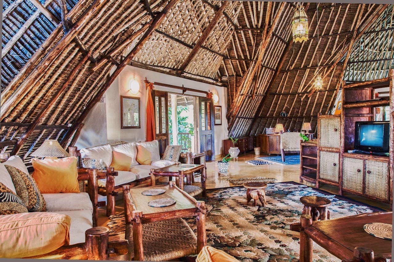 Open living area under a soaring makuti roof